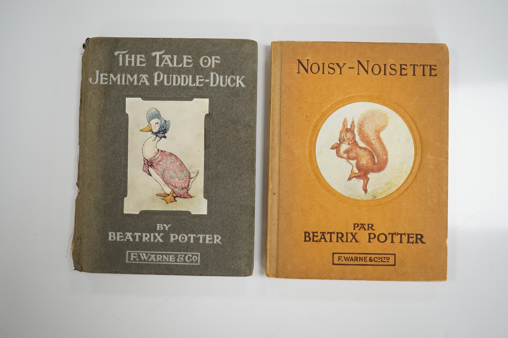 Potter, Beatrix - The Tale of Jemima Puddle-Duck. First Edition. title illus., frontis and 26 other coloured illus.; white lettered grey paperboards with a mounted coloured illus. on upper - having 'arrowhead' shaped cor